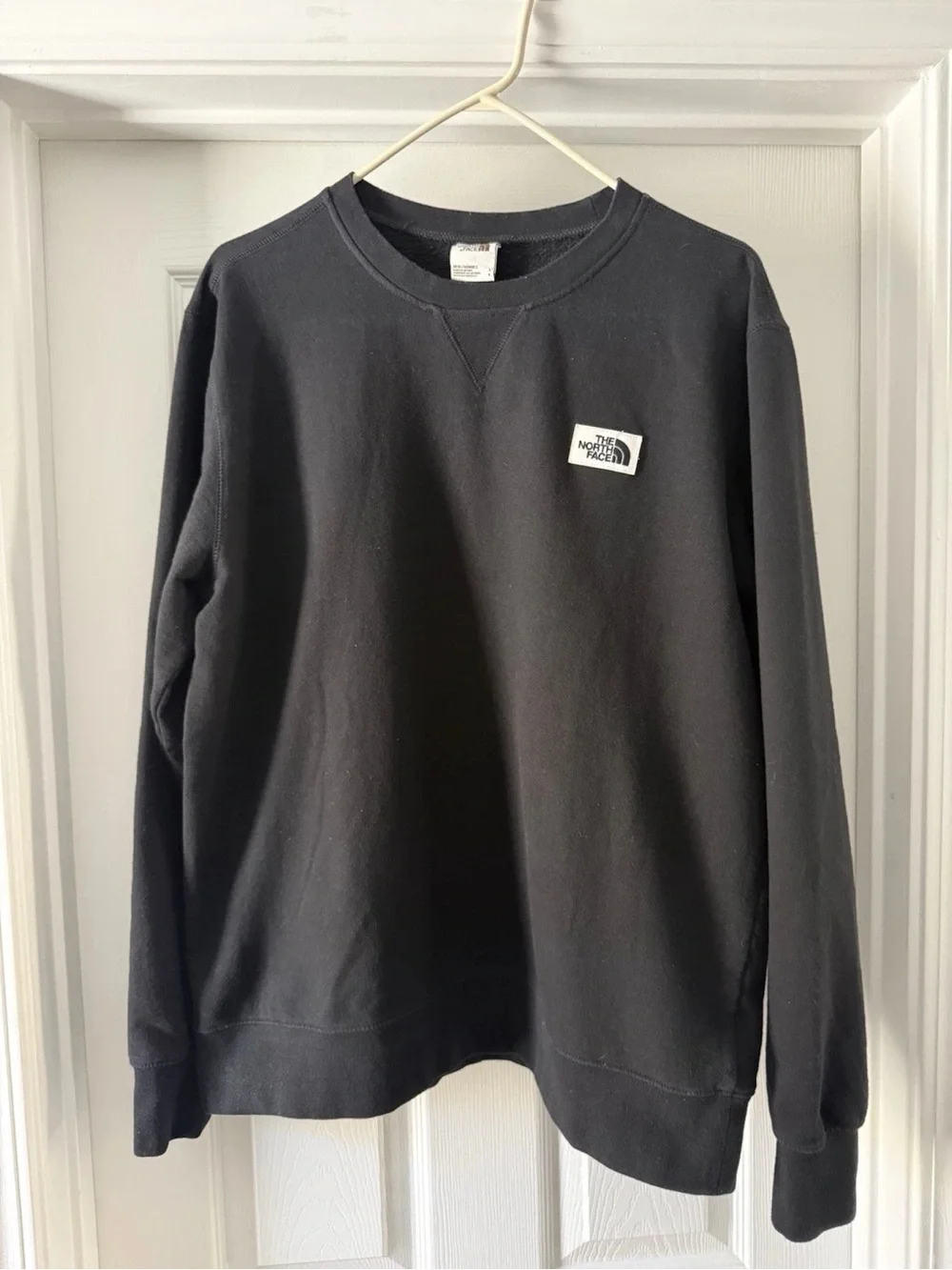 The North Face Black Crewneck Sweatshirt with Small Logo Patch